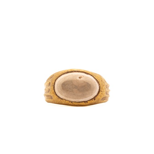 13 - A Late Roman Hollow Gold Ring with a Agate Cabochon.

The ring features a simple gold band with a sm... 