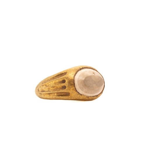 13 - A Late Roman Hollow Gold Ring with a Agate Cabochon.

The ring features a simple gold band with a sm... 