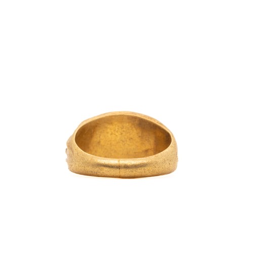 13 - A Late Roman Hollow Gold Ring with a Agate Cabochon.

The ring features a simple gold band with a sm... 