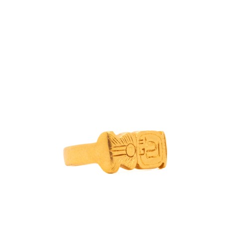 15 - An Egyptian Solid Gold Ring with Hieroglyphic Motif.

The ring features a solid band with engraved h... 