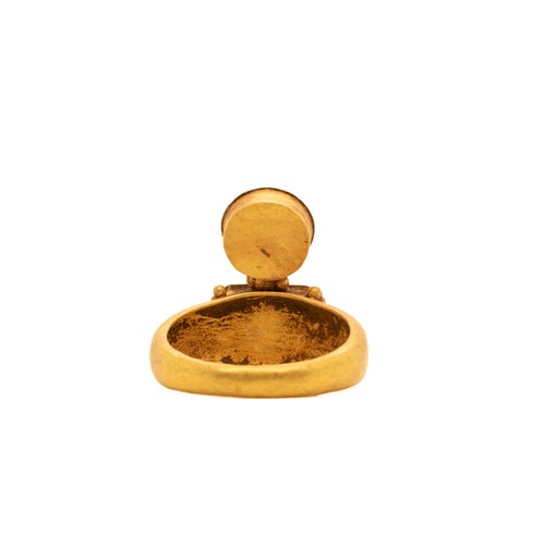 16 - A Byzantine Hollow Ring with Garnet and Emerald Cabochon.

This solid gold Byzantine ring features a... 