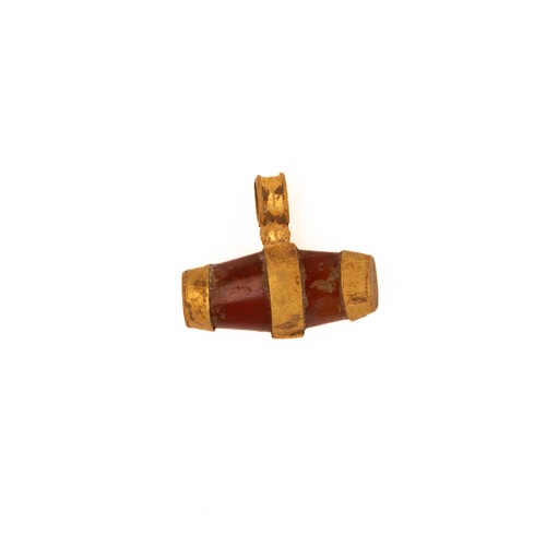 32 - A Roman Gold Pendant with Garnet Inlay.

A Roman gold pendant featuring a cylindrical garnet inlay. ... 