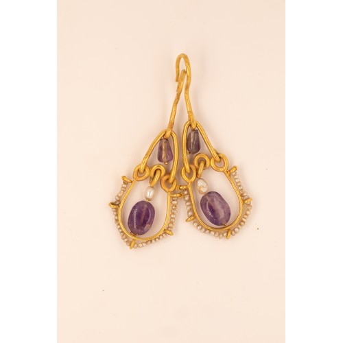 44 - A Pair of Medieval Gold Earrings with Amethyst and Pearls.

These medieval gold earrings feature a d... 