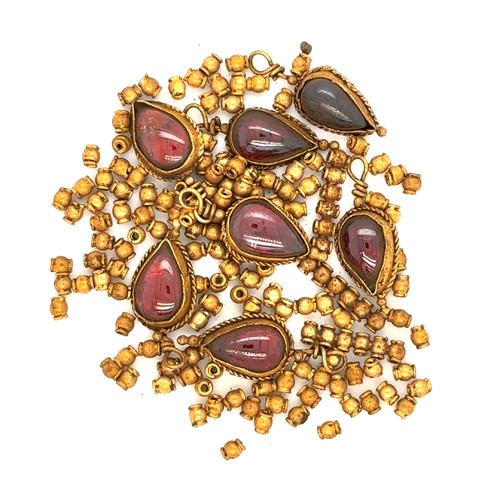 50 - A Lot of Roman Gold Beads and Garnet Pendants.

This collection includes a set of Roman gold beads p... 