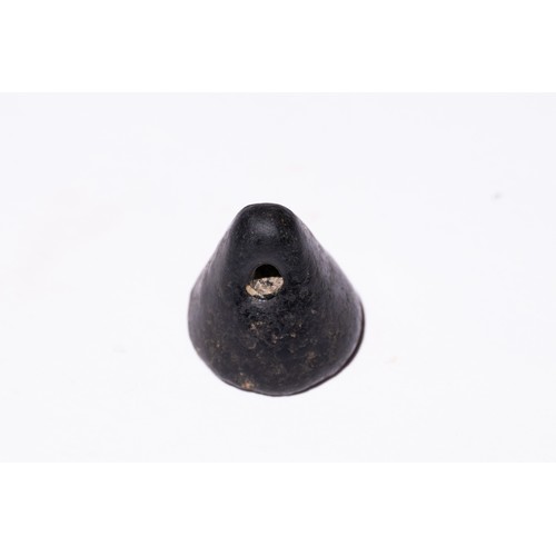 60 - A Near Eastern Hematite Cone Seal with Engraved Motifs.

A dark hematite cone-shaped seal featuring ... 