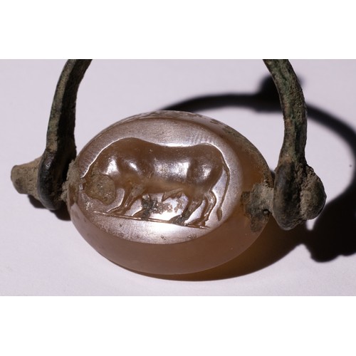 64 - A Hellenistic Agate Intaglio Seal with Charging Bull Motif.

A carved Hellenistic agate intaglio sea... 