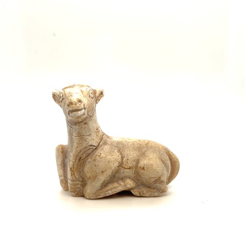 65 - A Parthian White Stone Pendant of a Ram, 247 B.C to 224 A.D.

The ram's body is positioned in a rela... 