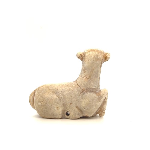 65 - A Parthian White Stone Pendant of a Ram, 247 B.C to 224 A.D.

The ram's body is positioned in a rela... 