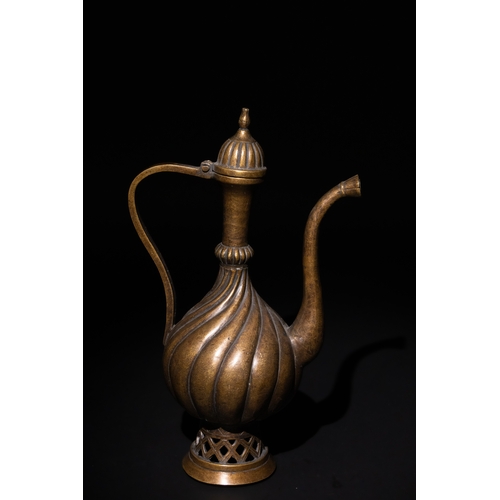 112 - An Islamic Ottoman Bronze Ewer with Fluted Design.

An Ottoman bronze ewer featuring an elegant flut... 