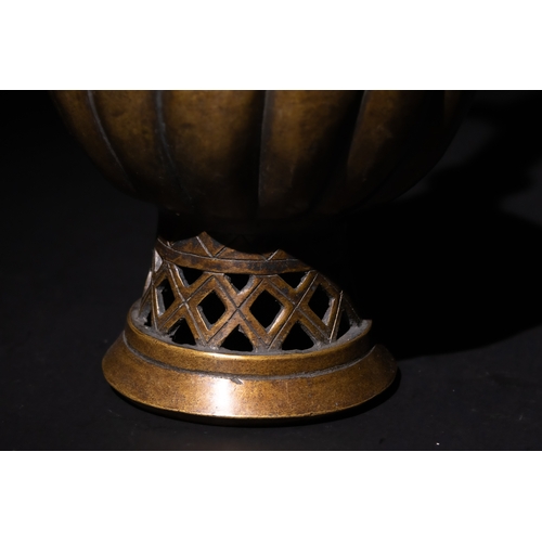 112 - An Islamic Ottoman Bronze Ewer with Fluted Design.

An Ottoman bronze ewer featuring an elegant flut... 