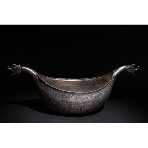 113 - An Islamic Safavid Kashkul Beggar's Bowl with Dragon Handles, 17th Century.

A curved Safavid copper... 