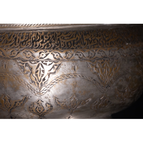 115 - A Persian Tinned-Copper Kashkul with Dragon Handles, 17th Century.

A tinned-copper vessel featuring... 