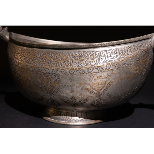 115 - A Persian Tinned-Copper Kashkul with Dragon Handles, 17th Century.

A tinned-copper vessel featuring... 