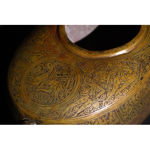 116 - A Qajar Brass Kashkul Beggar's Bowl with Islamic Calligraphy, 19th Century.

A brass Kashkul featuri... 