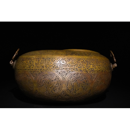 116 - A Qajar Brass Kashkul Beggar's Bowl with Islamic Calligraphy, 19th Century.

A brass Kashkul featuri... 