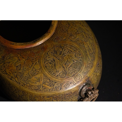 116 - A Qajar Brass Kashkul Beggar's Bowl with Islamic Calligraphy, 19th Century.

A brass Kashkul featuri... 