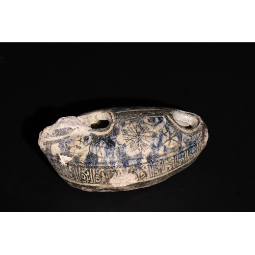 119 - An Islamic Near Eastern Ayyubid Glazed Fritware Oil Lamp, 13th Century.

This Islamic oil lamp from ... 