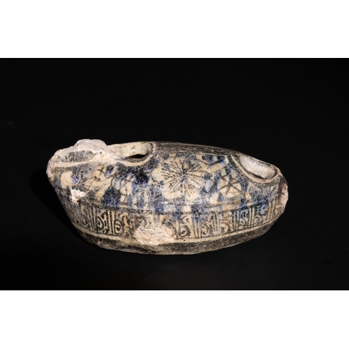 119 - An Islamic Near Eastern Ayyubid Glazed Fritware Oil Lamp, 13th Century.

This Islamic oil lamp from ... 