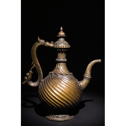 125 - An Indian Bronze Ewer Aftaba with Makara Handle, Possibly Mughal, 16-17th Century.

A bronze ewer, f...