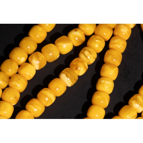 126 - An Islamic Amber Prayer Beads Tasbih with Black Tassel.

Each bead is smoothly rounded, contributing... 