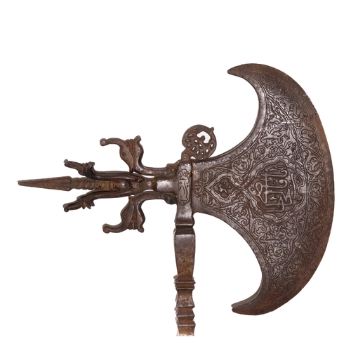 129 - An Islamic Ceremonial Iron Axe with Islamic Calligraphy and Intricate Patterns.

An Islamic ceremoni... 