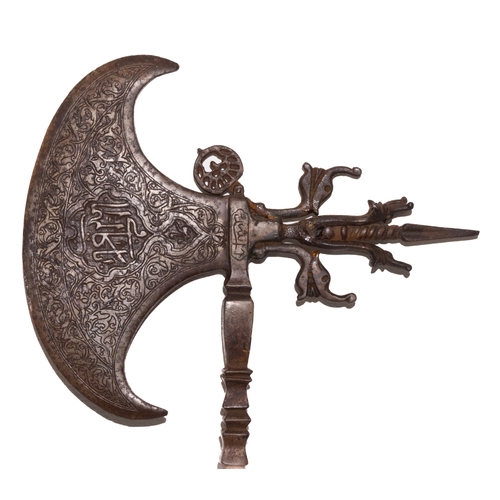 129 - An Islamic Ceremonial Iron Axe with Islamic Calligraphy and Intricate Patterns.

An Islamic ceremoni... 