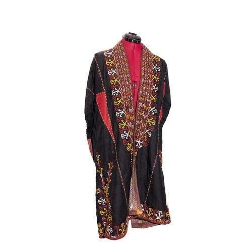 135 - A Central Asian Embroidered Silk Chapan.

A vibrant Central Asian silk chapan featuring an intricate... 