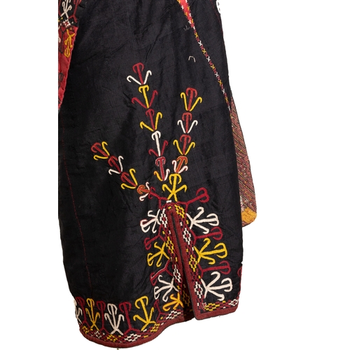 135 - A Central Asian Embroidered Silk Chapan.

A vibrant Central Asian silk chapan featuring an intricate... 