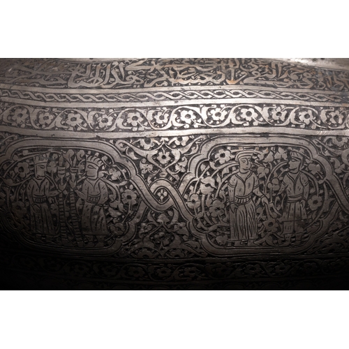 138 - An Islamic Qajar Iron Kashkul Beggar's Bowl with Intricate Inlay and Figurative Motifs.

This Qajar ... 