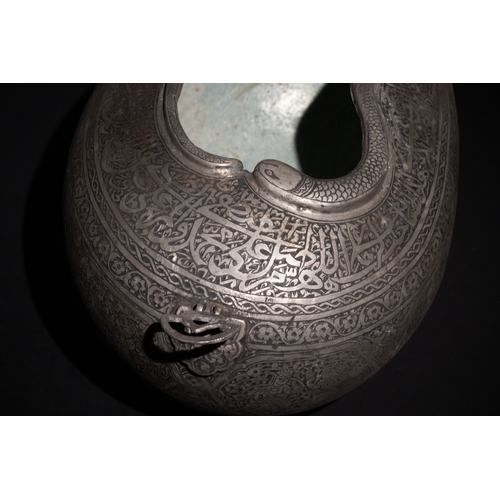 138 - An Islamic Qajar Iron Kashkul Beggar's Bowl with Intricate Inlay and Figurative Motifs.

This Qajar ... 