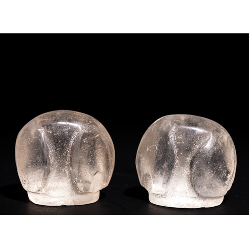 68 - A Pair of Islamic Rock Crystal Bishop Chess Pieces.

A pair of bishop chess pieces carved from trans... 