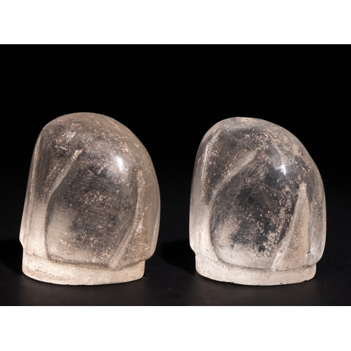 68 - A Pair of Islamic Rock Crystal Bishop Chess Pieces.

A pair of bishop chess pieces carved from trans... 