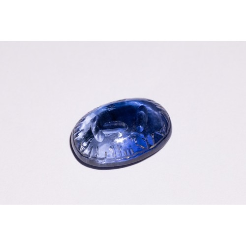 140 - An Islamic Carved Blue Gemstone, Possibly Sapphire, with Engraved Inscriptions.

This oval-shaped Is... 