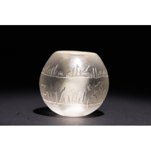 143 - An Islamic Carved Rock Crystal Amulet with Inscribed Islamic Calligraphy.

This rock crystal bead is... 