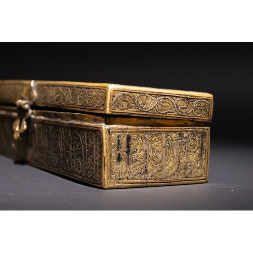 144 - An Islamic Khurasan Style Silver-Inlaid Brass Pen-Case.

A rectangular brass pen-case adorned with i... 