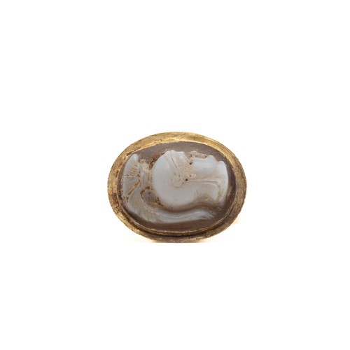 39 - A Roman Gold Hollow Ring with Cameo.

This Roman gold ring features a distinctive hollow band and is... 