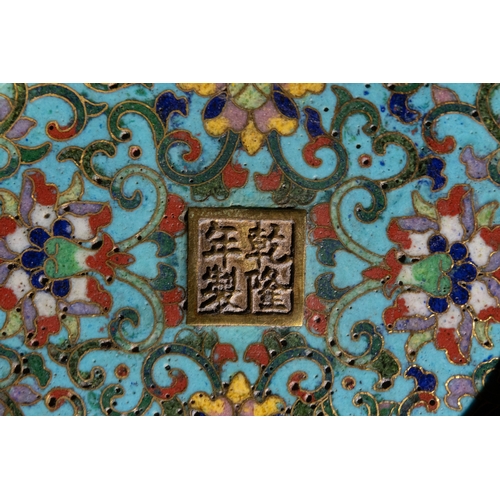 73 - A Chinese Cloisonné Enamel Stacking Box with Jade Finial, 19th Century.

A Chinese cloisonné enamel ... 