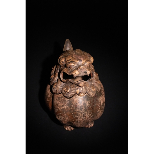 81 - A Chinese Bronze Censer in the Form of a Seated Temple Lion.

A Chinese bronze censer modelled as a ... 