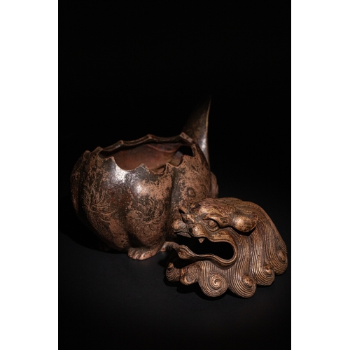 81 - A Chinese Bronze Censer in the Form of a Seated Temple Lion.

A Chinese bronze censer modelled as a ... 