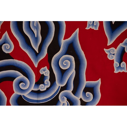 82 - A Chinese Cotton Textile with Cloud Motifs, 20th Century.

A vibrant Chinese cotton textile featurin... 