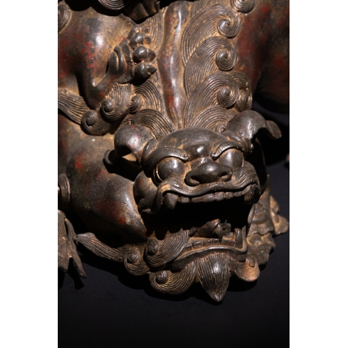 86 - A Chinese Bronze Censer in the form of Two Guardian Lion Dogs.

This Chinese incense burner is sculp... 
