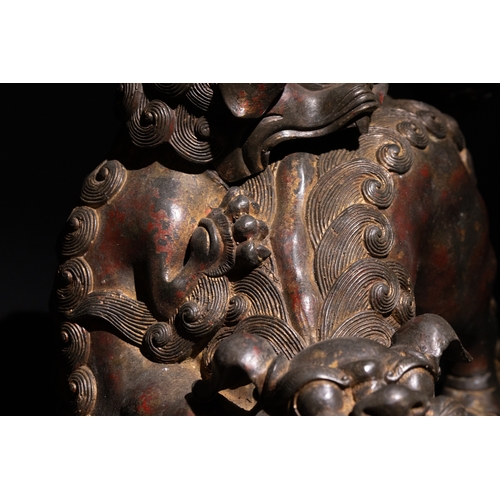 86 - A Chinese Bronze Censer in the form of Two Guardian Lion Dogs.

This Chinese incense burner is sculp... 