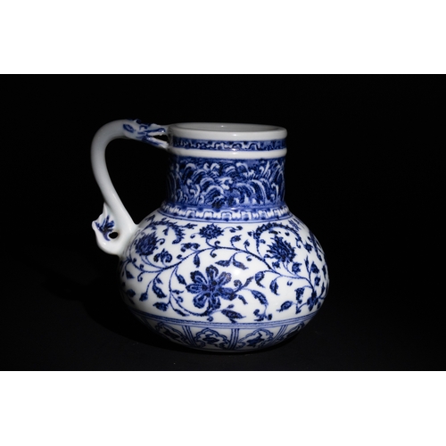 89 - A Chinese Blue and White Porcelain jug with Floral Motifs.

A Chinese porcelain jug adorned with int... 