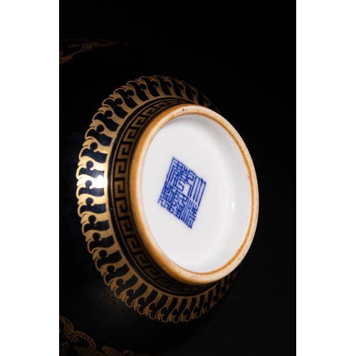 93 - A Chinese Black Ground Porcelain Vase with Gilded Patterns & Character Marks to the Base.

A Chinese... 