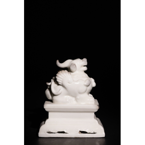 96 - A Chinese Blanc-de-Chine Porcelain Foo Dog Figure on a Pierced Base, with Character Marks to the Bas... 