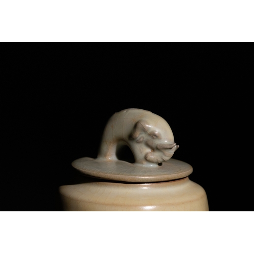 97 - A Chinese Crackle-Glazed Porcelain Jar with Elephant Finial Lid.

A porcelain jar featuring a creamy... 