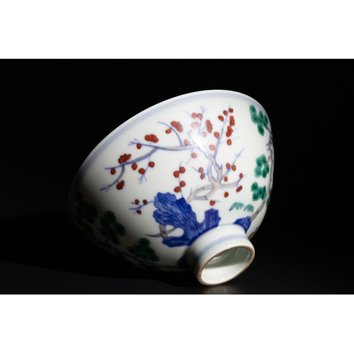 98 - A Chinese Famille Verte Porcelain Bowl with Bamboo, Plum, and Pine Motifs.

A Chinese porcelain bowl... 
