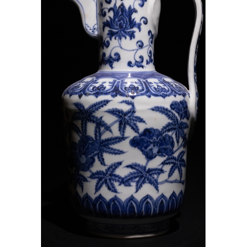 101 - A Chinese Blue and White Porcelain Ewer with Peony and Vine Motifs.

This blue and white porcelain e... 