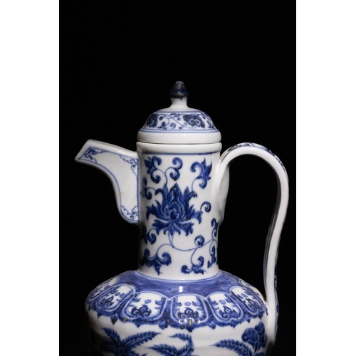 101 - A Chinese Blue and White Porcelain Ewer with Peony and Vine Motifs.

This blue and white porcelain e... 