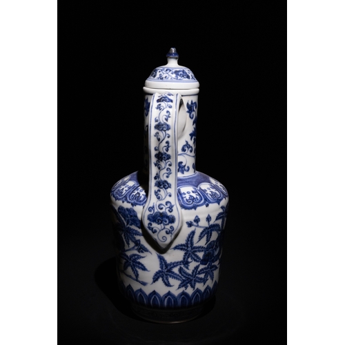 101 - A Chinese Blue and White Porcelain Ewer with Peony and Vine Motifs.

This blue and white porcelain e... 